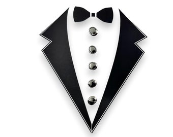 May include: Black and white illustration of a tuxedo with five silver buttons.