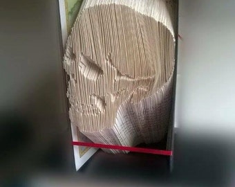 Book folding art pattern for a skull