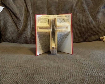 Book folding art pattern for a cross