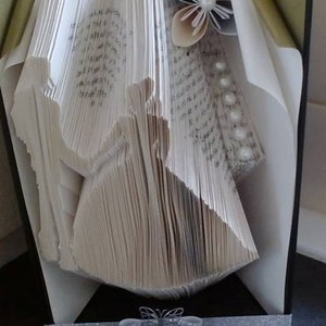 Book folding art pattern for a bride and groom