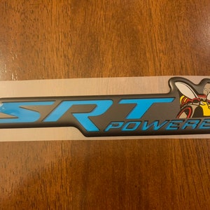 May include: A black and blue 3D emblem with the text "SRT POWERED" and a cartoon bee with a black helmet and goggles.