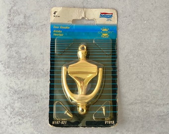 1990s brass door knocker in original packaging