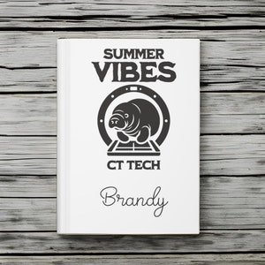 May include: White notebook with a black and white illustration of a manatee in a CT scan machine. The text "Summer Vibes CT Tech Brandy" is printed on the notebook.
