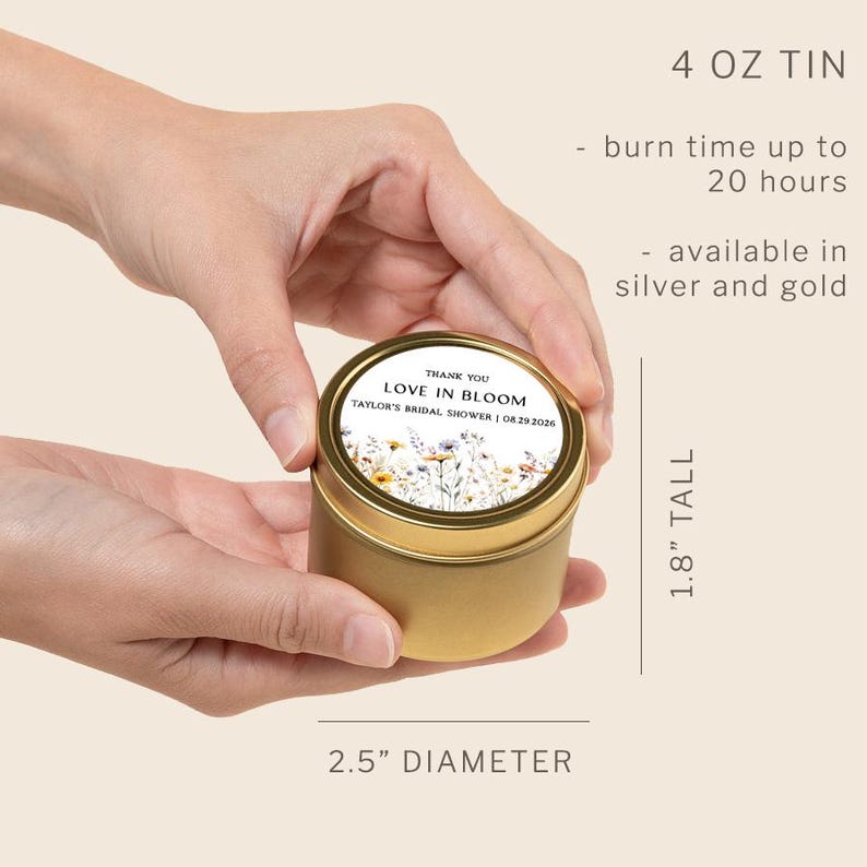 May include: A gold-colored 4 oz metal candle tin with a 2.5-inch diameter and 1.8-inch height. The lid features a label with a floral illustration and the text: THANK YOU LOVE IN BLOOM TAYLOR'S BRIDAL SHOWER | 08.29.2026. It has a 20-hour burn time.