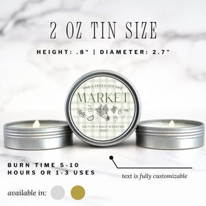 May include: Three small, silver-colored tin candles. The center candle has a label that reads "SHE'S FRESH OFF THE MARKET" with the text "KAITLYN'S BACH WEEKEND 2026". The height is .8 inches and the diameter is 2.7 inches. Burn time is 5-10 hours or 1-3 uses.