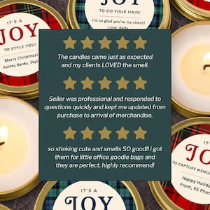 May include: Several round gold-colored metal candle tins with custom labels featuring red or blue plaid patterns and text including IT'S A JOY TO STYLE YOU and IT'S A JOY TO CAPTURE MEMORIES. A dark green overlay displays three five-star customer reviews.