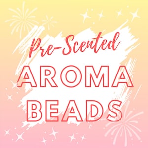 May include: Pre-Scented Aroma Beads on a white background with a pink and yellow gradient. The text is in red.