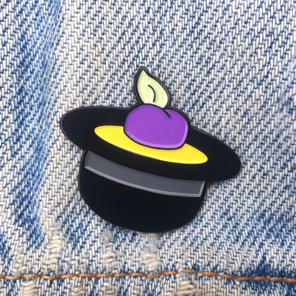 a single plum floating in perfume served in a man's hat // The Simpson's Yoko Ono Lapel Enamel Pin