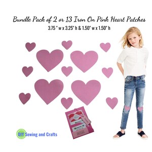 May include: A pack of 13 pink iron-on heart patches in two sizes: 3.75 inches wide by 3.25 inches high and 1.50 inches wide by 1.50 inches high. The patches are shown on a pair of jeans.