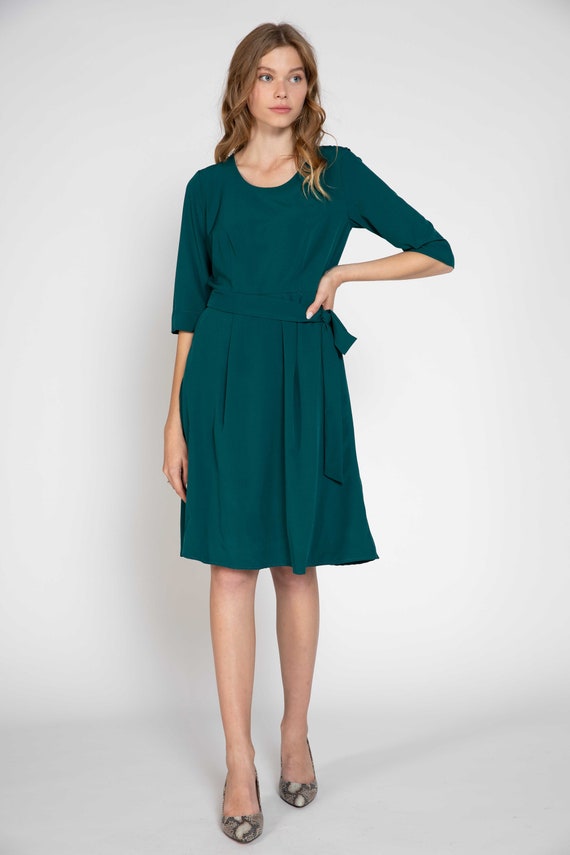 green fit and flare dress with sleeves