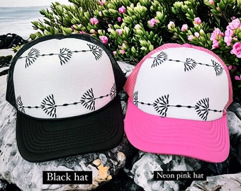 New black and white design trucker hat available in a variety of different brim colors and sizes!