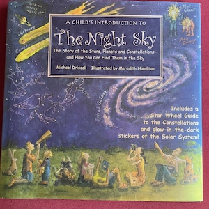 May include: A children's book titled "The Night Sky" with illustrations of stars, planets, and constellations. The cover features a dark blue background with illustrations of the solar system, people looking at the sky, and the text "Includes a Star Wheel Guide to the Constellations and glow-in-the-dark stickers of the Solar System!"