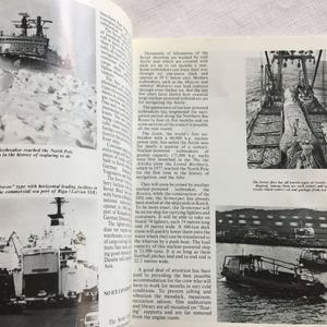 May include: A black and white photo of a ship breaking through ice. The text reads "The Soviet fleet has all known types of vessels at its disposal, among them are special icebreakers which remove oil and garbage from new ports."
