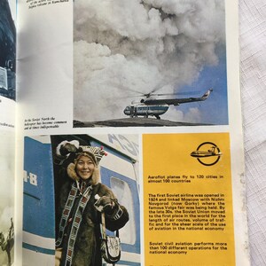 May include: A white helicopter flies over a cloudy sky. The text below the image reads "Aeroflot planes fly to 120 cities in almost 100 countries".