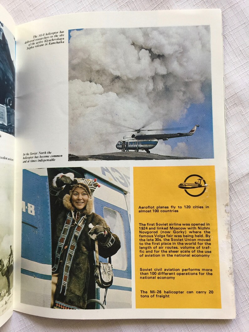May include: A white helicopter flies over a cloudy sky. The text below the image reads "Aeroflot planes fly to 120 cities in almost 100 countries".