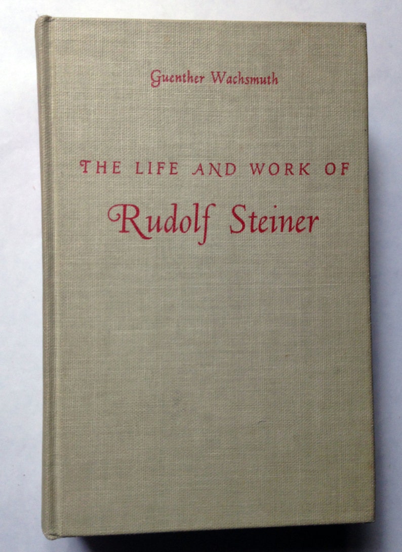 May include: A beige book with the title "The Life and Work of Rudolf Steiner" in red lettering. The author's name, Guenther Wachsmuth, is printed in black lettering at the top of the cover.