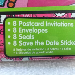 May include: Green and white label with a pink and white Hello Kitty pattern in the background. The label lists the contents of the party supplies: 8 Postcard Invitations, 8 Envelopes, 8 Seals, and 8 Save the Date Stickers. The label also includes the text in Spanish: 8 Tarjetas de invitaci&oacute;n 8 Sobres 8 Sellos 8 Etiquetas de guarda el d&iacute;a.