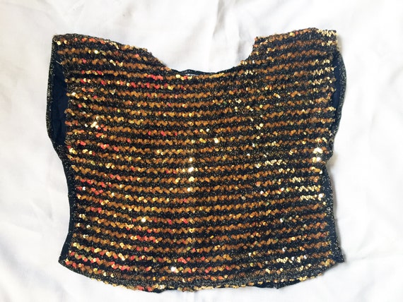 black top with gold sequins