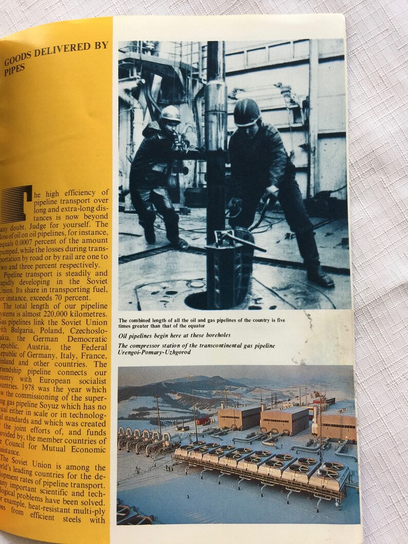 May include: A black and white photo of two workers operating a large metal pipe. The photo is taken from a low angle, showing the workers in action. The text below the photo reads: "The combined length of all the oil and gas pipelines of the country is five times greater than that of the equator. Oil pipelines begin here at these boreholes. The compressor station of the transcontinental gas pipeline Urengoi-Pomary-Uzhgorod."