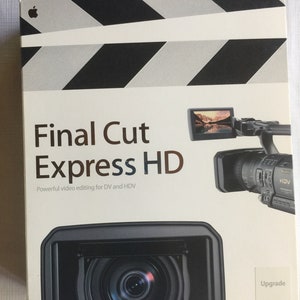 Puede incluir: Una caja de producto blanca para el software Final Cut Express HD con un gráfico de claqueta de cine en blanco y negro en la parte superior, el logotipo de Apple y una imagen de una videocámara Sony HDV. El texto dice Final Cut Express HD y Upgrade.