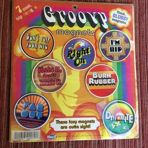 May include: A set of seven groovy magnets with colourful designs and phrases such as "Don't Flip Your Wig", "Right On", "Shake It, Don't Break It", "Burn Rubber", "Far Out", "I'm Hip", and "Dynamite". The magnets are thick and glossy.