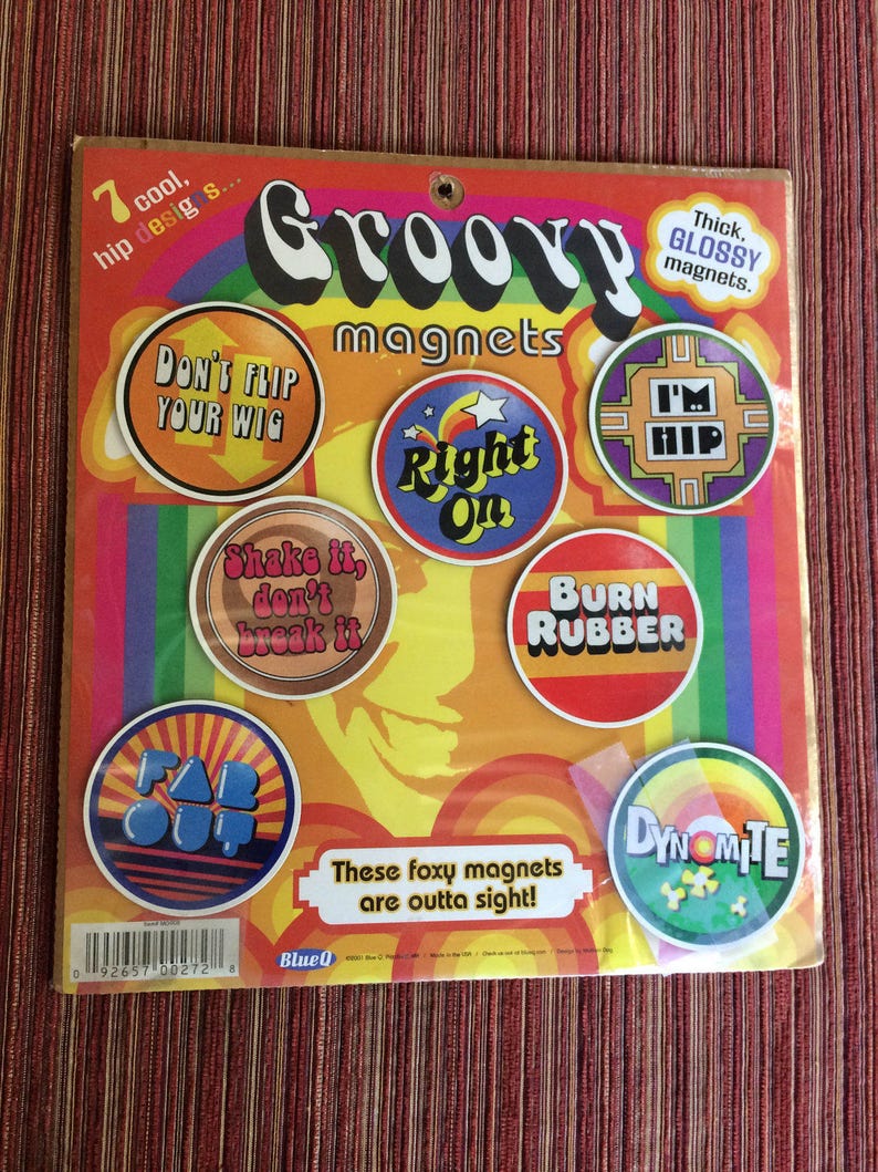 May include: A set of seven groovy magnets with colourful designs and phrases such as "Don't Flip Your Wig", "Right On", "Shake It, Don't Break It", "Burn Rubber", "Far Out", "I'm Hip", and "Dynamite". The magnets are thick and glossy.