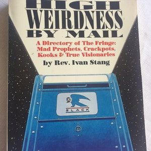 May include: A book titled "High Weirdness by Mail: A Directory of The Fringe: Mad Prophets, Crackpots, Kooks & True Visionaries" by Rev. Ivan Stang. The cover features a blue mailbox with a red, white, and blue eagle logo that says "SLACK".