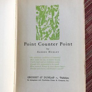 May include: A vintage book cover with a green illustration of people dancing and playing music. The title of the book is "Point Counter Point" by Aldous Huxley. The book is published by Grosset & Dunlap.