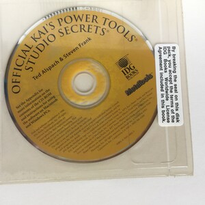 May include: A yellow CD-ROM disc with the title "Official Kai's Power Tools Studio Secrets" and the authors "Ted Alspach & Steven Frank". The disc is labelled with the IDG Books Worldwide logo and the text "Metafools".