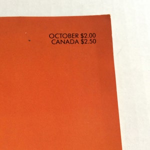 May include: Close-up of a magazine cover with an orange background and the text "OCTOBER $2.00 CANADA $2.50"
