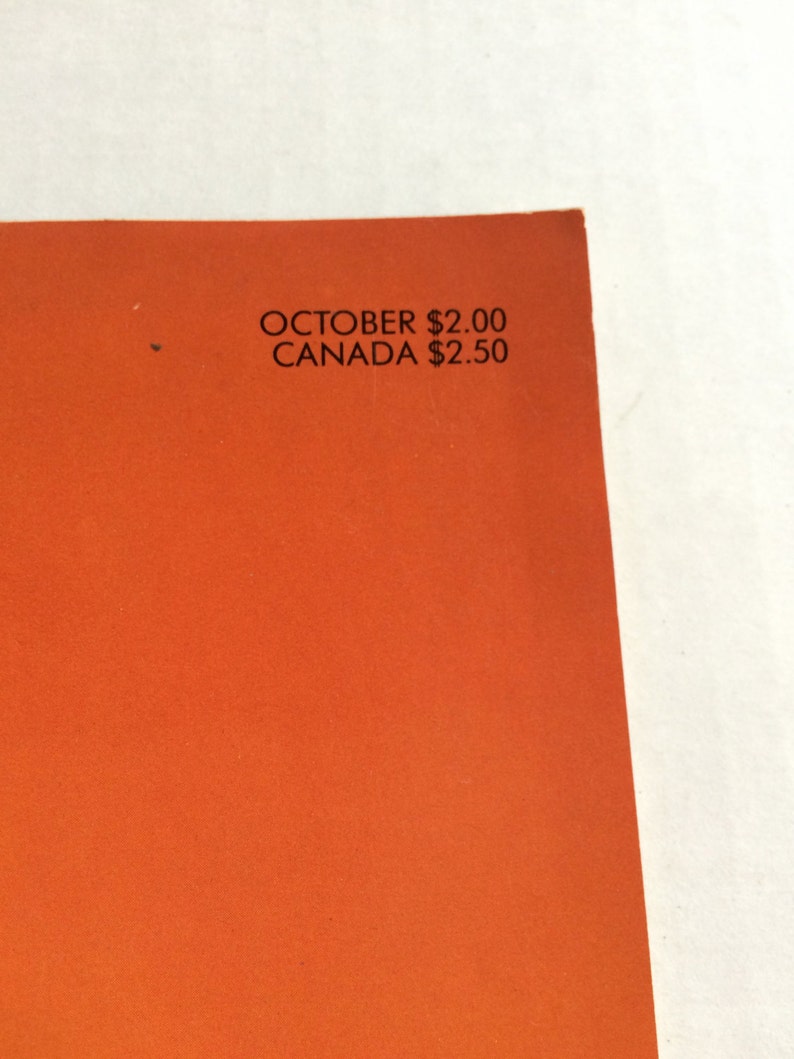 May include: Close-up of a magazine cover with an orange background and the text "OCTOBER $2.00 CANADA $2.50"