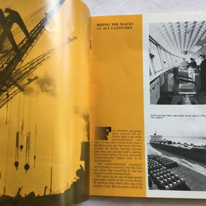 May include: A vintage book with a yellow cover and black text. The text reads "Riding the Waves at All Latitudes". The book is open to a page with a black and white photo of a ship's bridge and a photo of a large ship in the water.