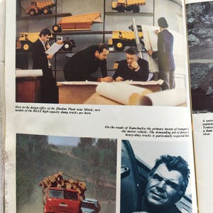 May include: A black and white photo of a man in a truck cab. The man is looking at the camera. The truck is carrying logs. The text in the image reads: "On the roads of Kamchatka the primary means of transport is the motor vehicle. The demanding job of drivers of heavy-duty trucks is particularly respected there."