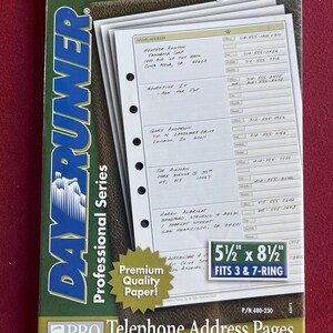 May include: A pack of Day-Runner Professional Series telephone address pages featuring white paper with pre-printed fields for names, addresses, and phone numbers. The packaging displays the text 5 1/2 inch by 8 1/2 inch fits 3 and 7-ring.