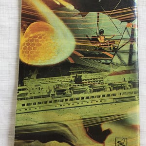 May include: A vintage book cover with a colorful collage of images. The cover features a large, yellow, honeycomb-like sphere, a flying saucer, a ship, and a person in a flying machine. The text "Moskva" is visible on the cover.
