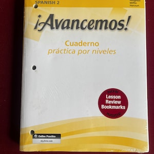 May include: A Spanish 2 workbook titled ¡Avancemos! features a yellow and white cover with the text "Cuaderno práctica por niveles." A red sticker indicates "Lesson Review Bookmarks Inside." The book is sealed in plastic.