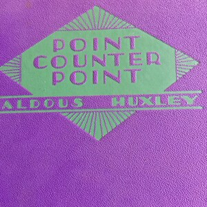 May include: Purple book with a green diamond-shaped logo that says "Point Counter Point" in a vintage font.