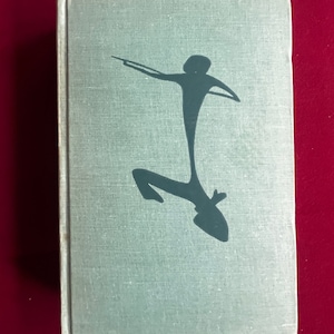 May include: A light blue book cover with a black silhouette of a person holding a stick and jumping in the air.