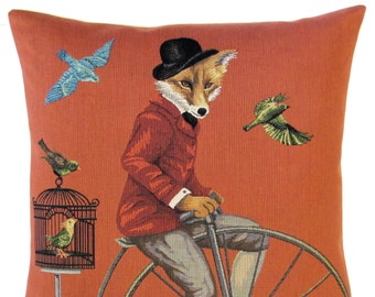 jacquard woven belgian tapestry gobelin throw pillow cushion with dressed up fox riding a bicycle and birds in a cage