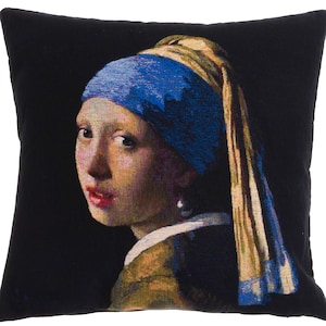 May include: A tapestry pillow featuring a reproduction of Johannes Vermeer's famous painting, "Girl with a Pearl Earring". The pillow depicts a young woman with a blue headscarf and a pearl earring, set against a dark background.