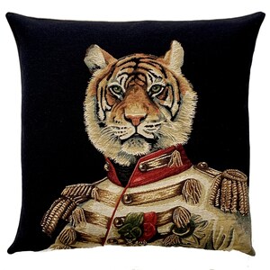 May include: A black and white tapestry cushion featuring a tiger wearing a military uniform with gold trim and a red sash. The tiger has a serious expression and is looking directly at the viewer.