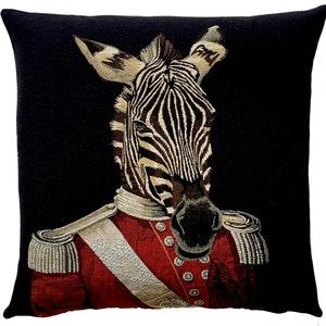 May include: A black and white zebra wearing a red military uniform with gold trim. The zebra's head is facing forward and its eyes are looking directly at the viewer. The background is black.