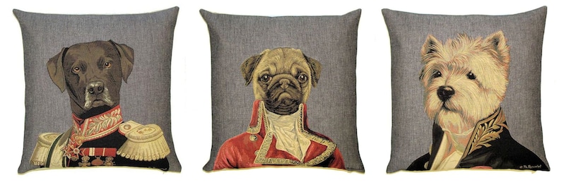 May include: Three square throw pillows with a gray textured background. Each pillow features a portrait of a dog dressed in a historical military uniform. The dogs depicted are a dark-coated dog, a pug, and a white terrier-type dog.