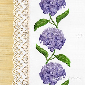 May include: Embroidered design of a white background with a lace border and three purple hydrangea flowers with green leaves.