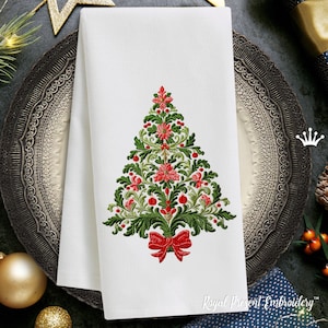 May include: Embroidered Christmas tree design on a white linen napkin. The tree is decorated with red poinsettias, green leaves, and red berries. A red bow is tied at the base of the tree.