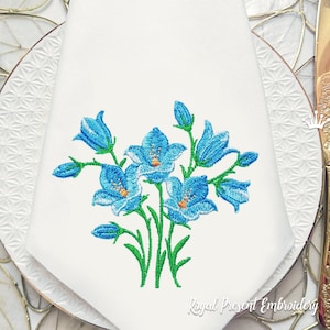May include: Embroidered design of blue bell flowers with green stems and leaves on a white background.