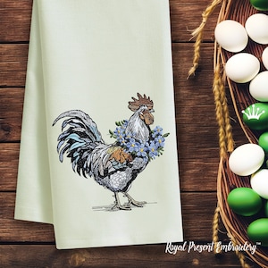 May include: A white rooster with a blue and green tail feathers wearing a wreath of blue flowers around its neck. The rooster is embroidered on a light green tea towel.