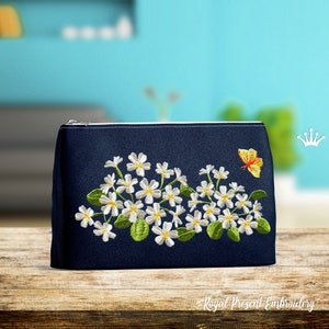 May include: A navy blue zippered pouch with a white floral embroidery design and a yellow butterfly. The pouch is on a wooden surface. "Royal Present Embroidery" is printed on the surface.