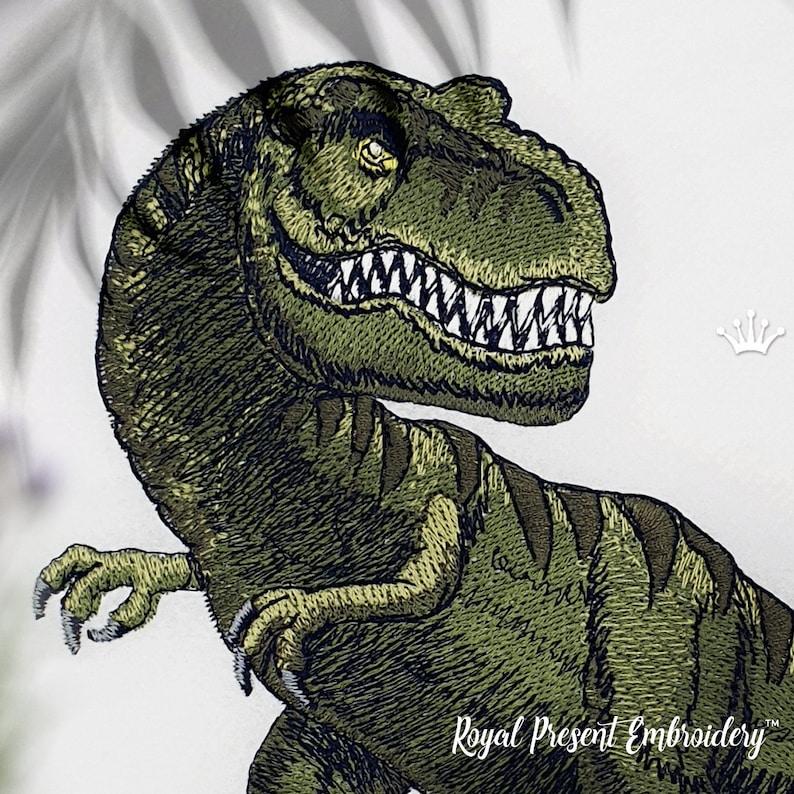 May include: Embroidered green dinosaur with sharp teeth and claws. The dinosaur is facing right and has a textured, detailed design. The text "Royal Present Embroidery" is visible at the bottom of the image.