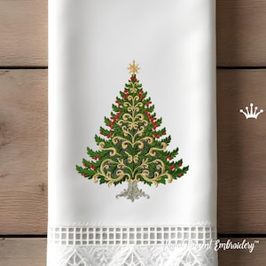 May include: White Christmas-themed towel featuring an embroidered Christmas tree design. The tree is green with red berries, gold accents, and a gold star on top. The bottom of the towel has a white lace trim.